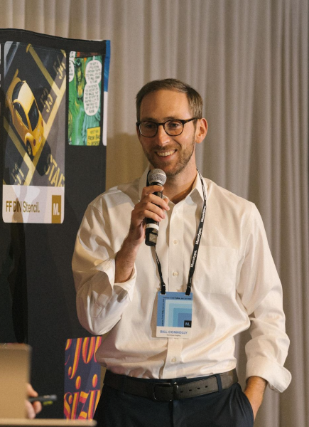 Bill Connolly speaking at event.